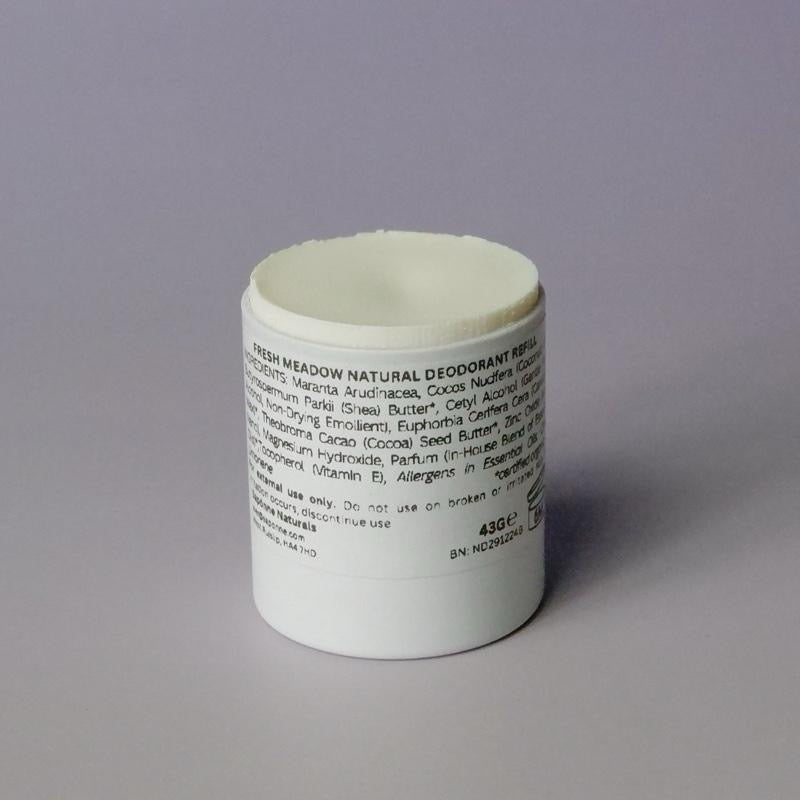 White deodorant stick with text on a gray background