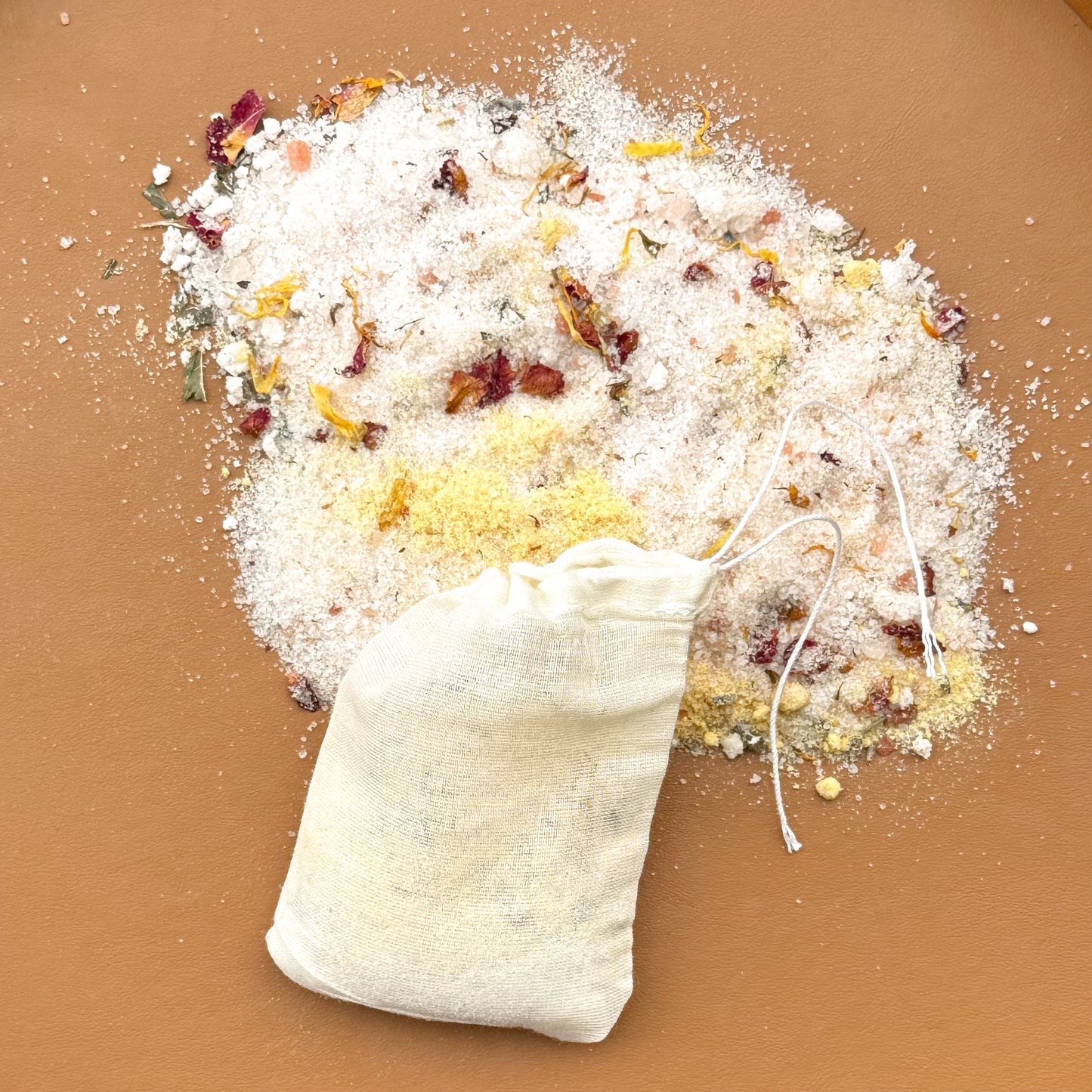 Aromatherapy bath soak with organic botanicals and milk in reusable pouch