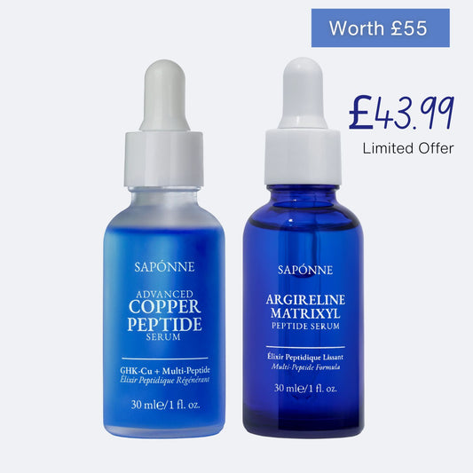 Two blue serum bottles with droppers on a white background, featuring Saponne branding.