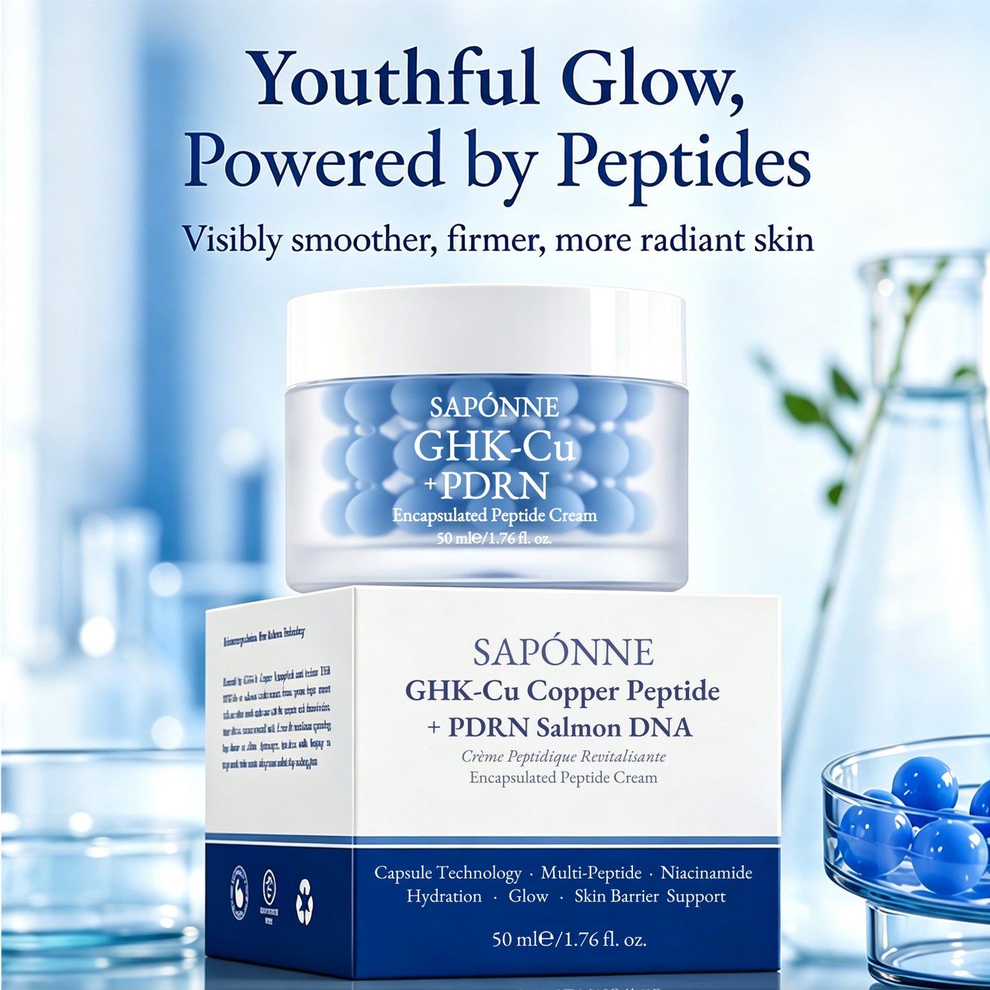 Sapónne GHK-Cu + PDRN Encapsulated Peptide Cream shown in a clear jar with blue gel spheres, placed in front of its white and navy box. The scene is a styled studio setup with a soft blue background, decorative glassware, and text reading 'Youthful Glow, Powered by Peptides.