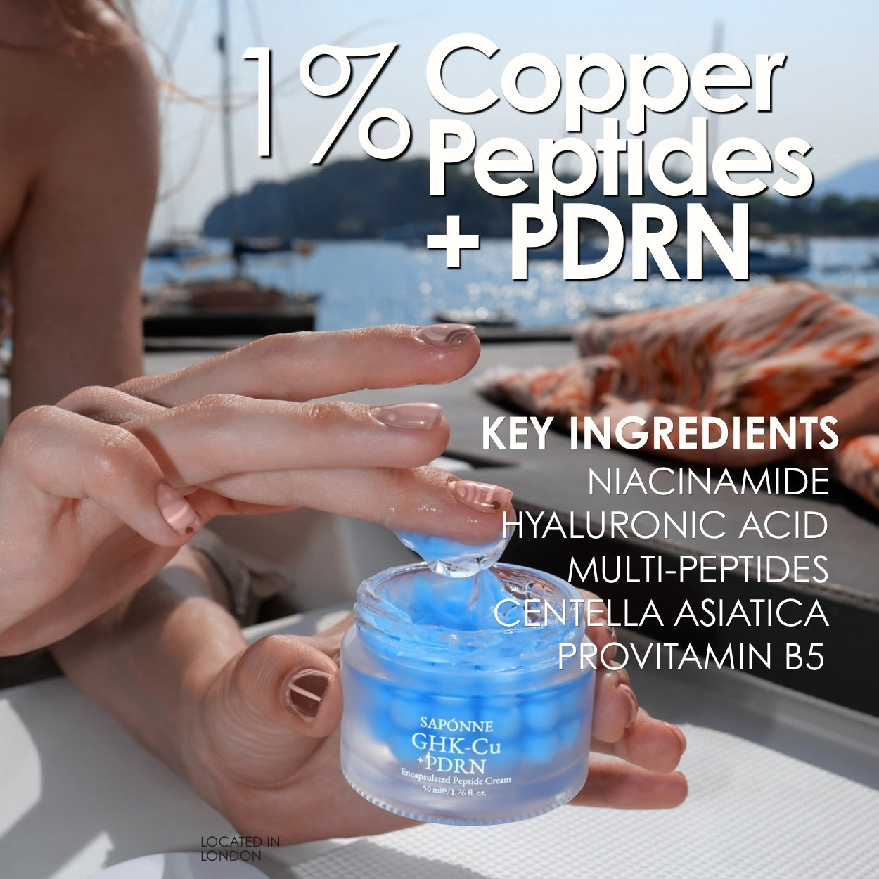 A person holds a small clear jar of blue gel cream outdoors with water and boats in the background. Large text reads '1% Copper Peptides + PDRN' and lists key ingredients including niacinamide, hyaluronic acid, multi-peptides, centella asiatica, and provitamin B5.